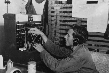 Telephone operator plugging phone calls circa 1947